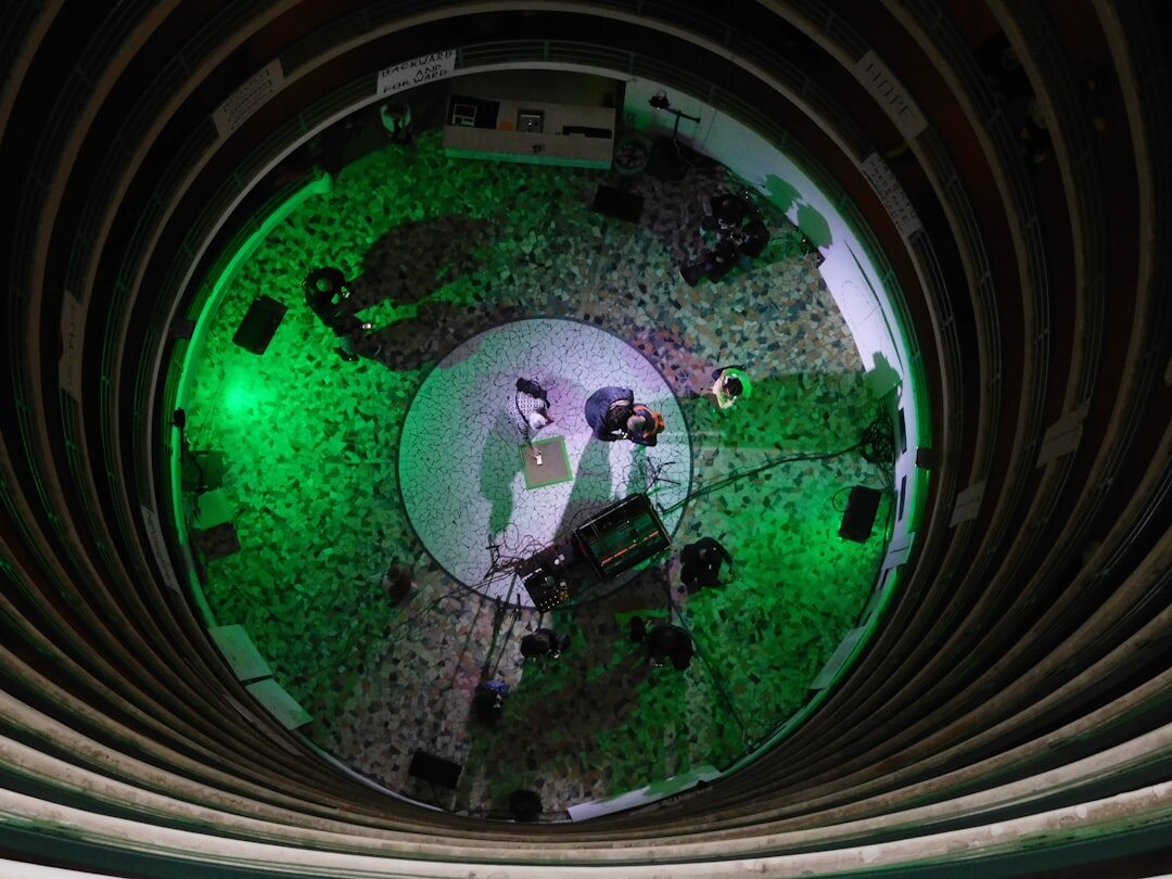 Overhead view of busy newsroom with journalists